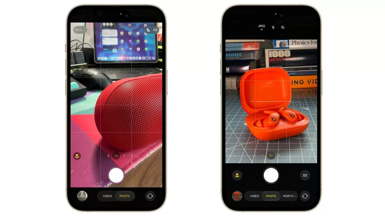 Two smartphones displaying camera apps; left phone focuses on a red portable speaker on a colorful desk, right phone focuses on an open red wireless earbuds case on a cutting mat.