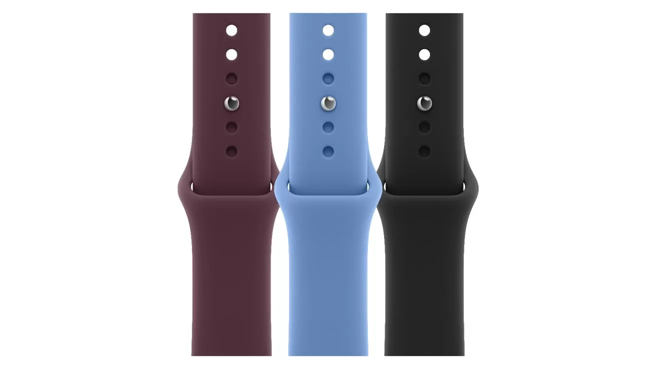 Three silicone smartwatch bands displayed vertically side by side, in dark maroon, light blue, and black colors, each showing adjustment holes and metal fasteners against a white background