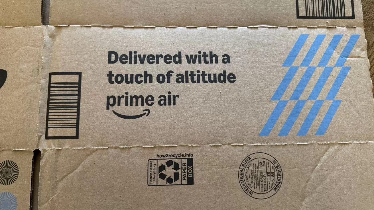 Cardboard Amazon Prime Air shipping box showing printed slogan 
