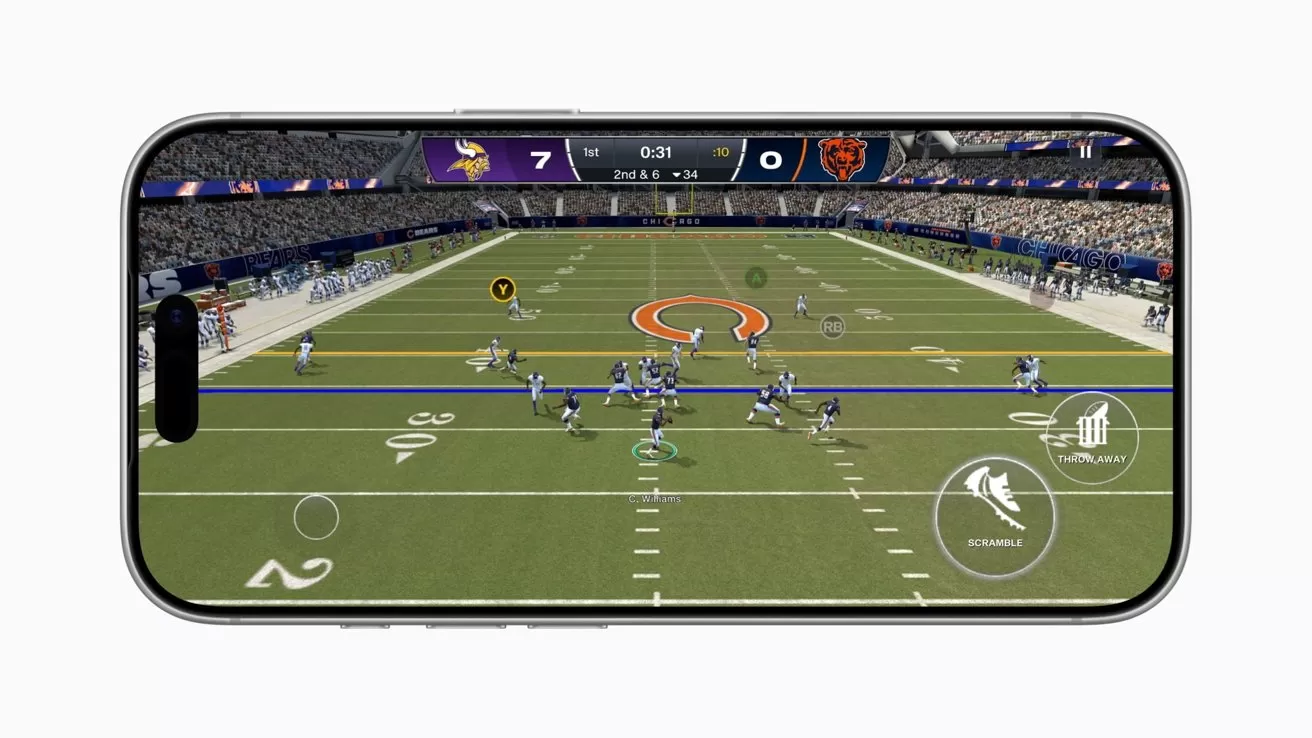 Smartphone screen showing an American football video game, with Vikings leading Bears 7&mdash; 0, offensive formation on the field, virtual buttons overlaid, and a large stadium crowd in the background