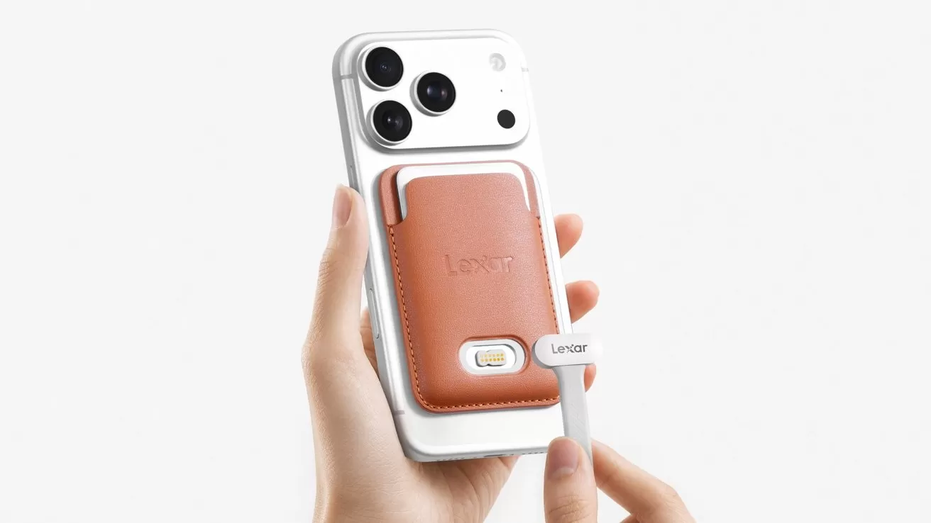 Hand holding a white smartphone with three rear cameras and a tan leather MagSafe-style wallet attached; another hand inserts a small rectangular accessory labeled Lemar into the wallet slot
