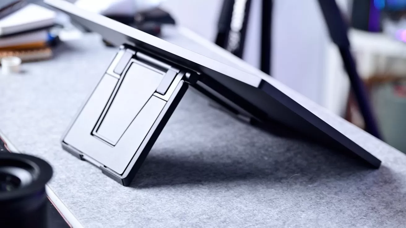 A metal stand holding up the back of a display at a low angle