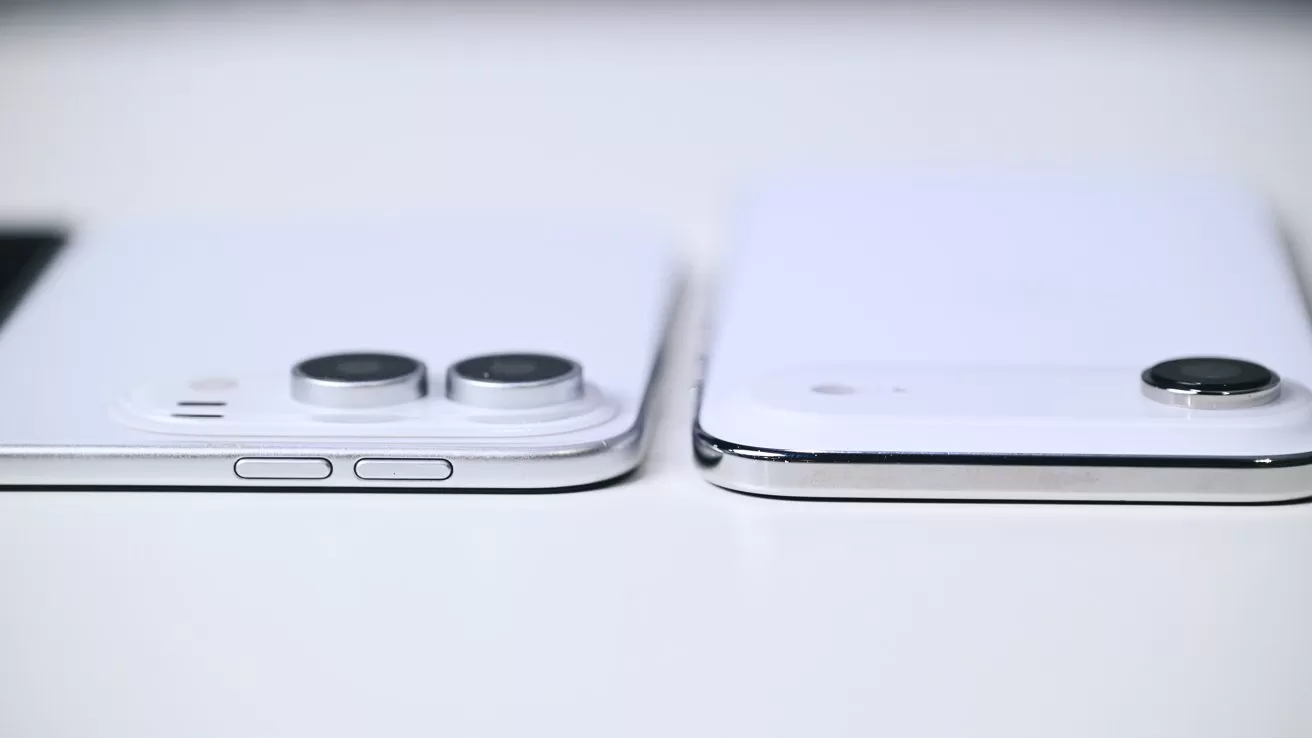 Two white smartphones lying flat on a table, shown from the side, highlighting their raised rear camera bumps and slim silver edges