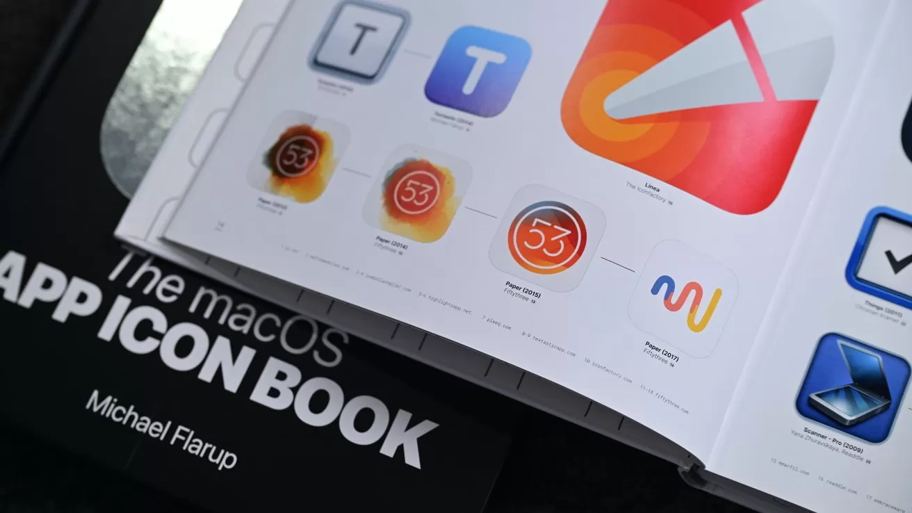 Open book titled The macOS App Icon Book by Michael Flarup, showing glossy pages of colorful macOS app icons arranged in neat rows on a dark surface