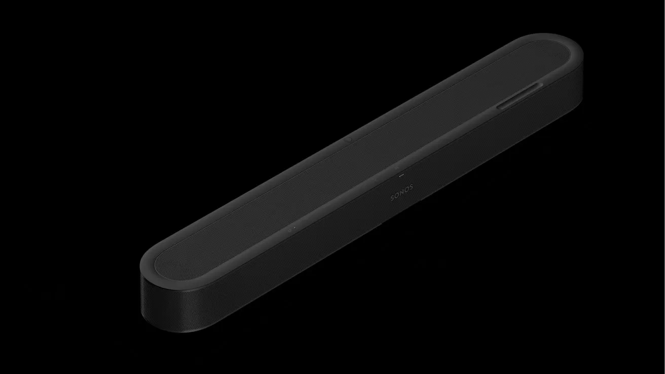 Sleek black rectangular soundbar with rounded corners, viewed at an angle on a solid black background, showing a minimalist, unmarked front surface