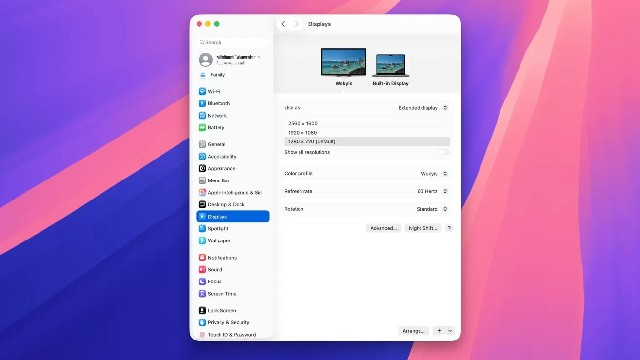 Computer display settings window showing two monitors, resolution options, color profile, and refresh rate on a vibrant pink and blue gradient background