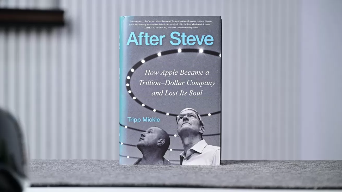 Book titled After Steve standing upright on a gray surface, showing two men looking upward on the cover with subtitle about Apple becoming a trillion-dollar company and losing its soul