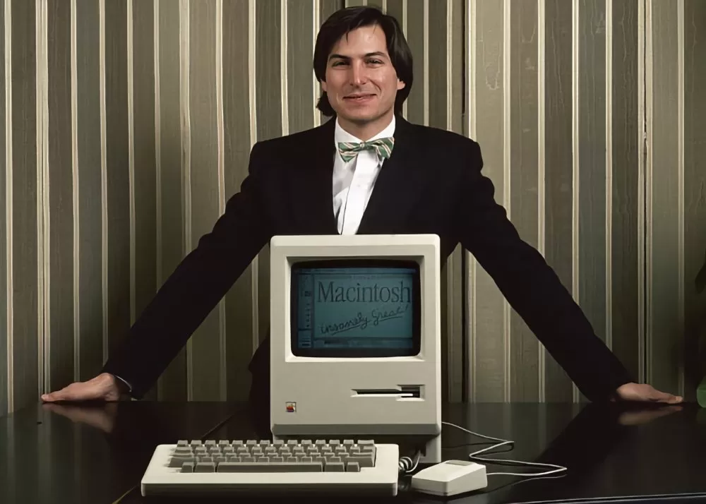 Steve Jobs presenting the original Mac