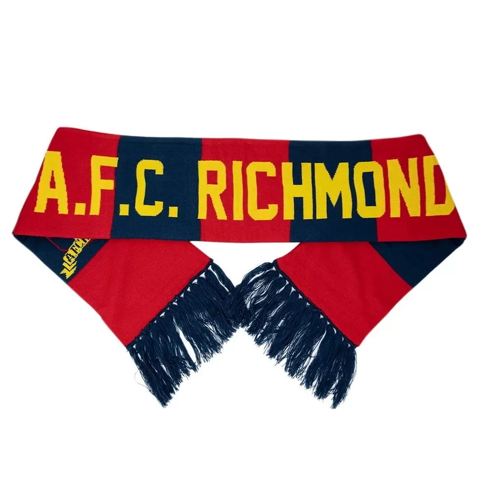 Red and navy striped soccer scarf with yellow text A.F.C. Richmond, featuring fringed ends, laid flat with ends crossed at the bottom