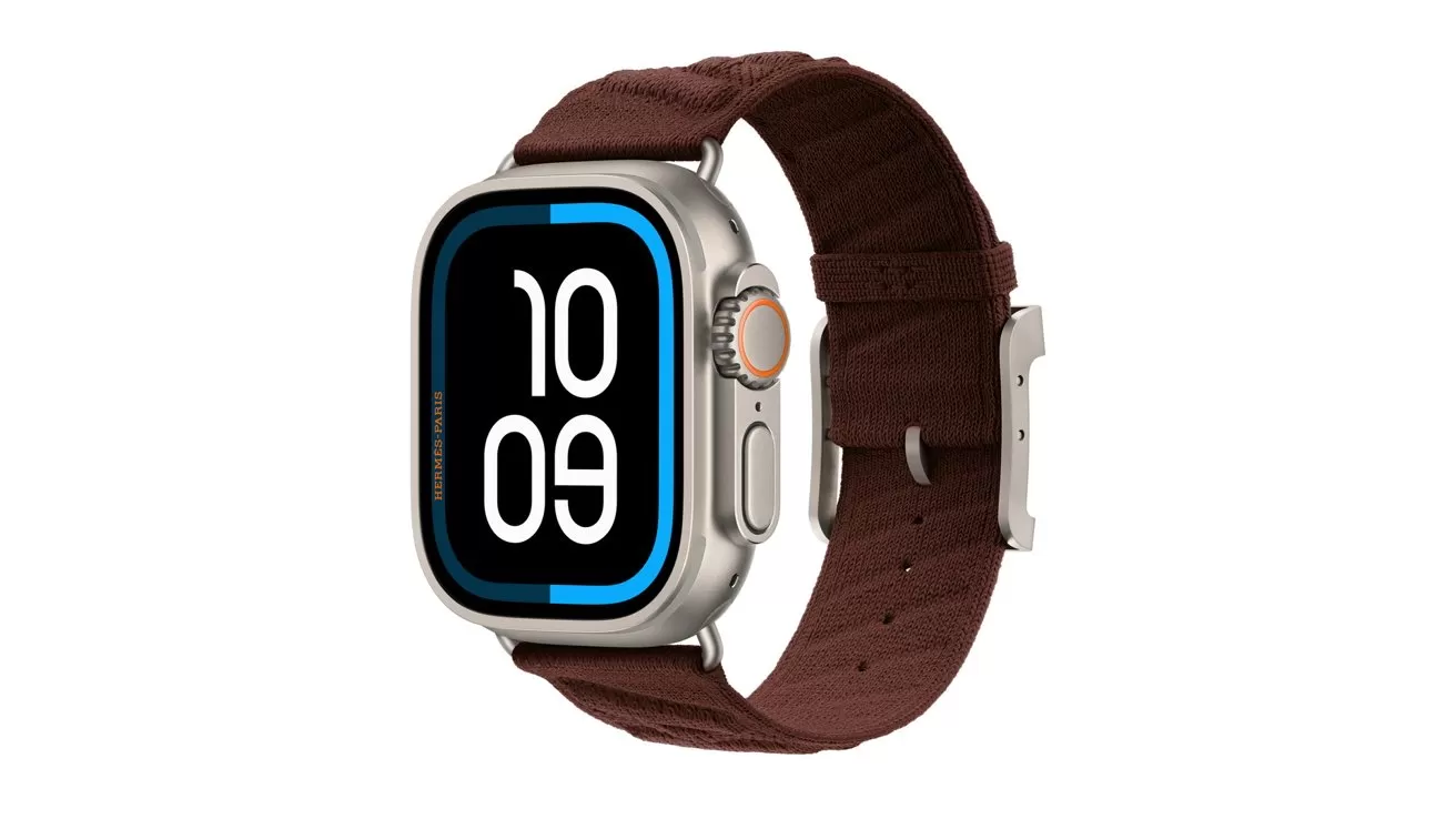 Smartwatch with large rounded rectangular screen showing bold vertical numbers, silver metal case, and thick dark brown textured band with buckle, viewed at an angle on white background