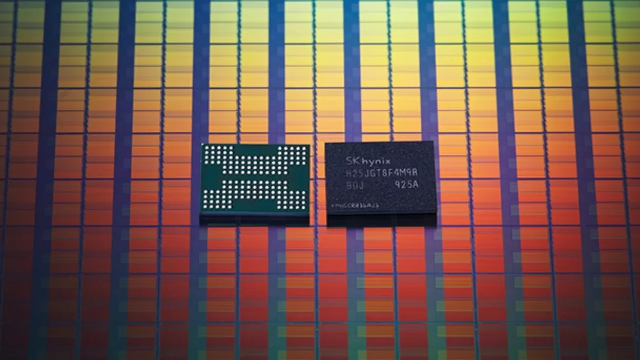 Two small SK hynix memory chips resting on a colorful, grid-patterned silicon wafer background with vertical rows in gradients of red, orange, yellow, green, and blue