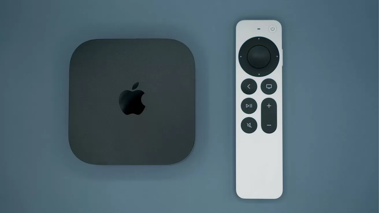 Apple TV box with sleek black finish and Apple logo, placed beside a slim white remote control featuring a circular touchpad and several black buttons on a blue background