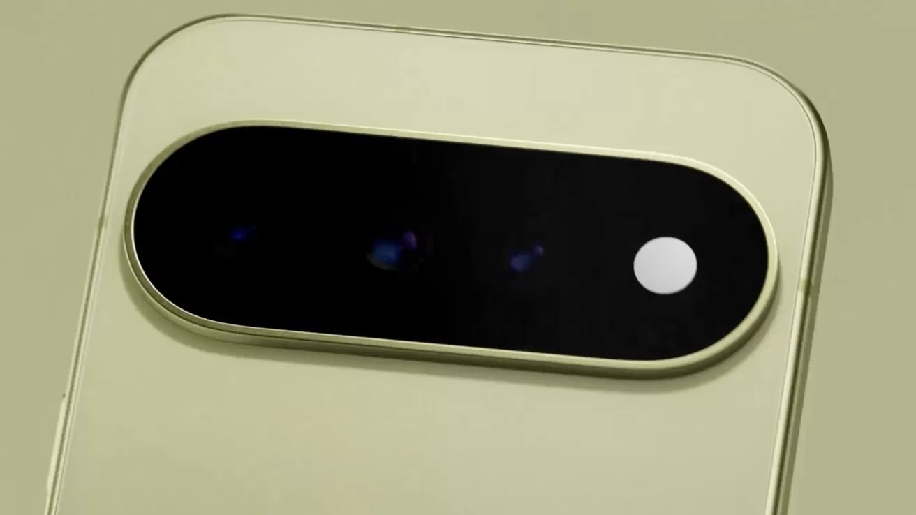 Close-up of a beige smartphone's rear camera module with a horizontal black oval housing multiple lenses and a small white flash on a smooth, light-colored back panel