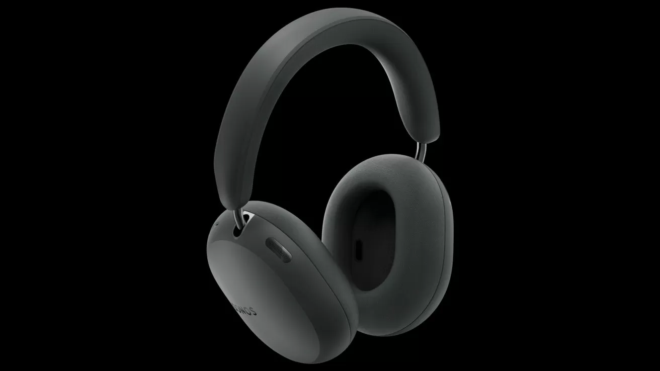 Sleek black over ear wireless headphones with cushioned ear cups and a curved padded headband, shown against a plain dark background